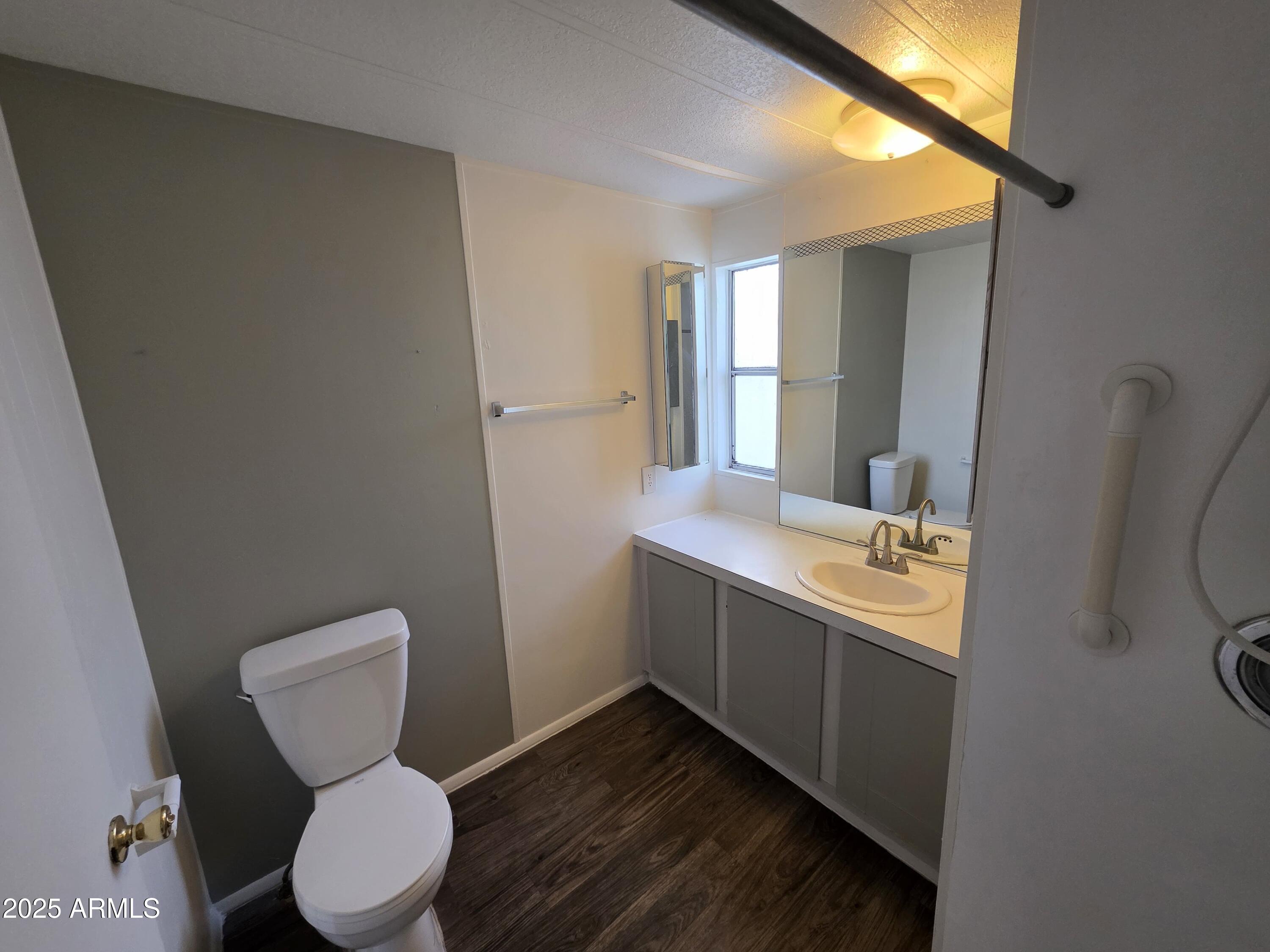 4800 West Ocotillo Road, Unit 105 Glendale, AZ 85301 - Photo 13 of 20 a bathroom with a toilet sink and mirror