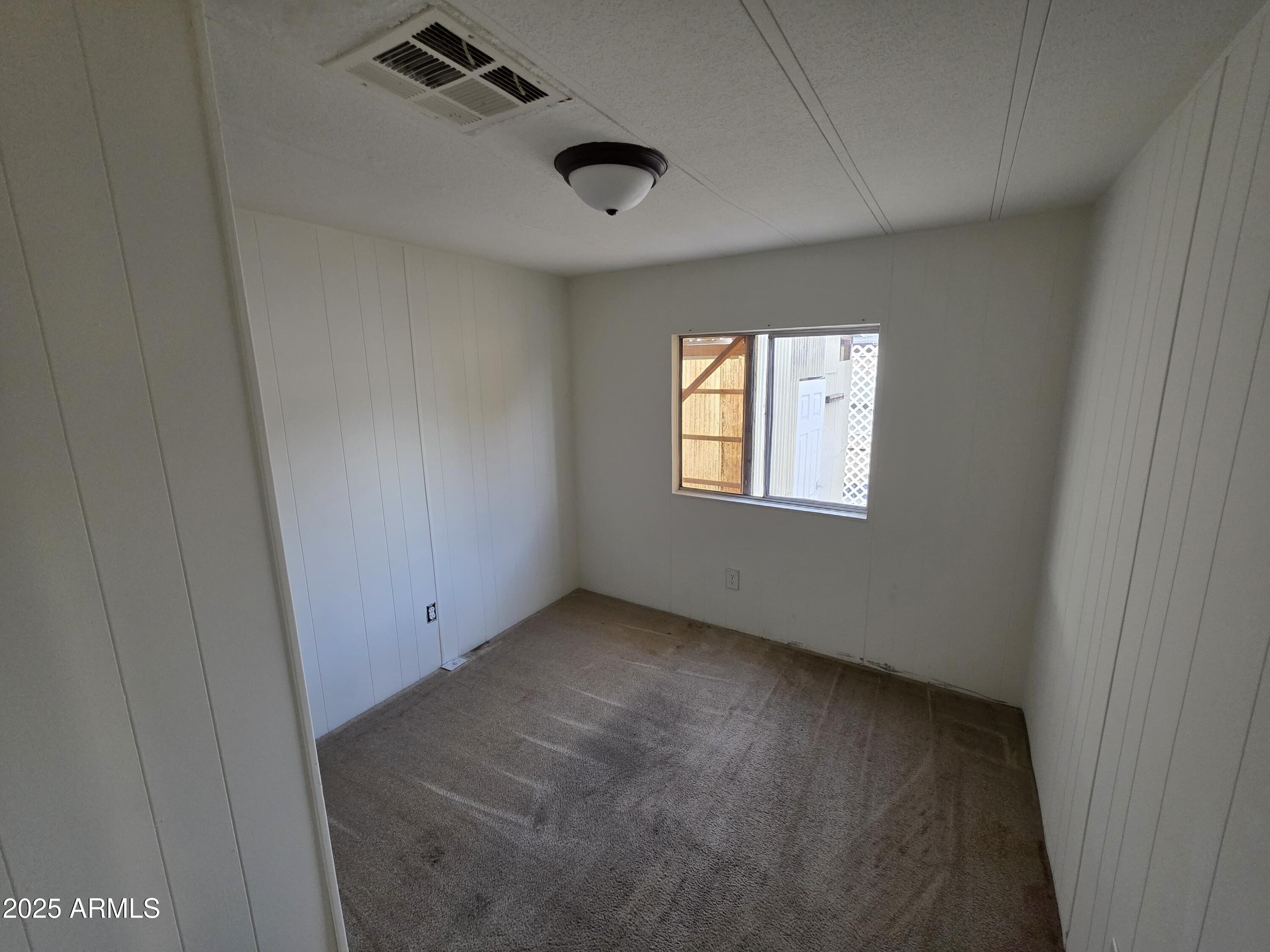 4800 West Ocotillo Road, Unit 105 Glendale, AZ 85301 - Photo 16 of 20 a view of an empty room with a window