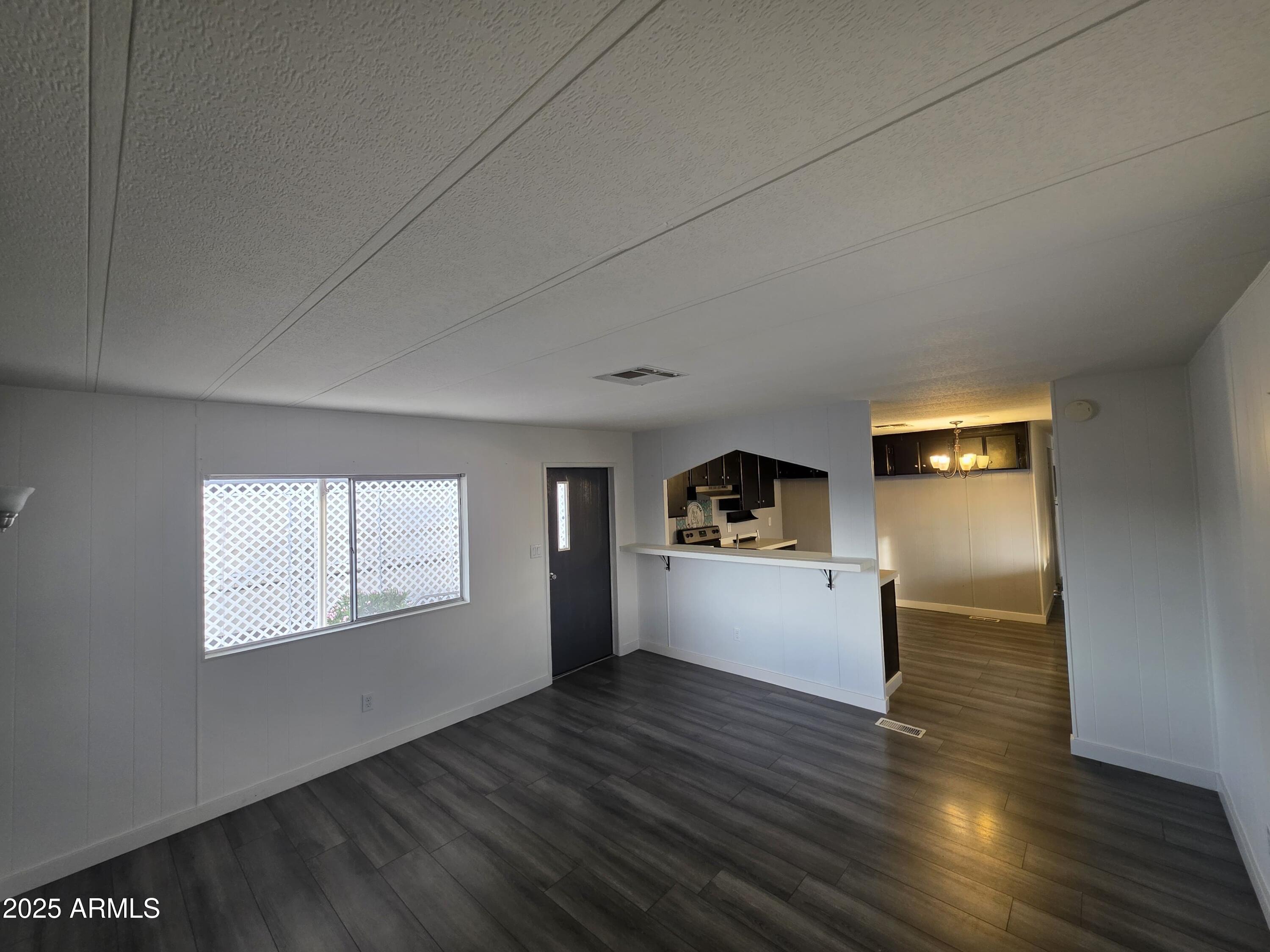 4800 West Ocotillo Road, Unit 105 Glendale, AZ 85301 - Photo 7 of 20 a view of empty room with wooden floor