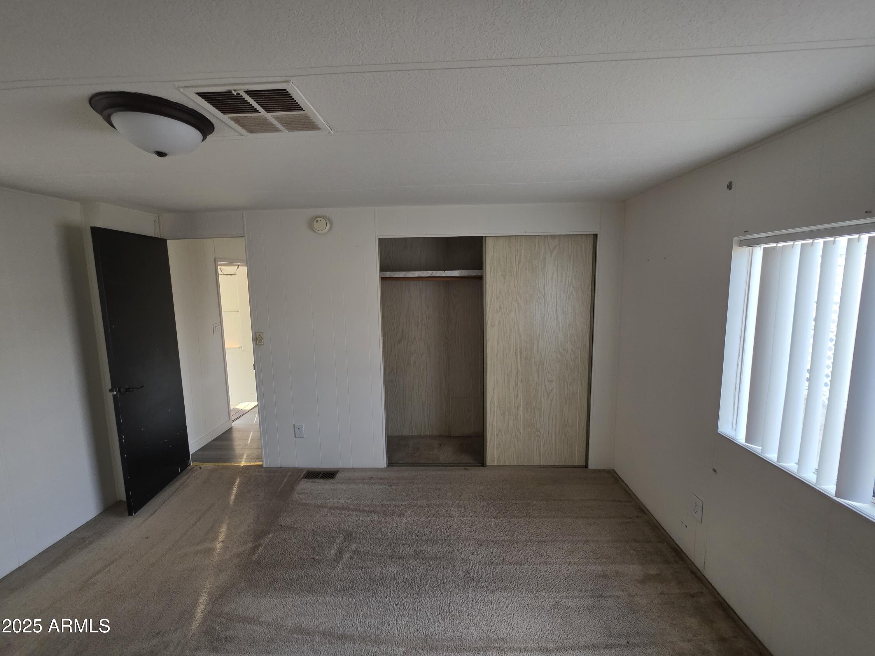 4800 West Ocotillo Road, Unit 105 Glendale, AZ 85301 - Photo 10 of 20 an empty room with windows
