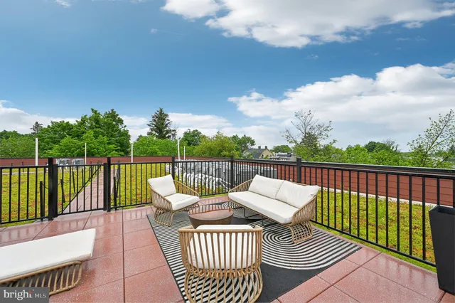 a view of balcony with furniture
