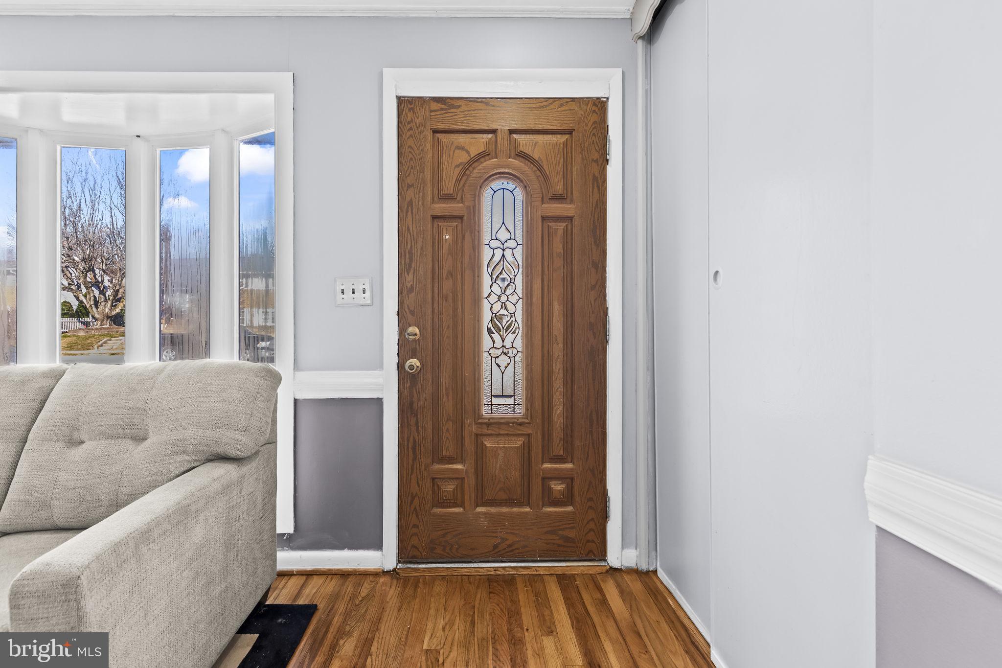 3407 Orbitan Road Parkville, MD 21234 - Photo 11 of 23 a living room with a furniture and a window