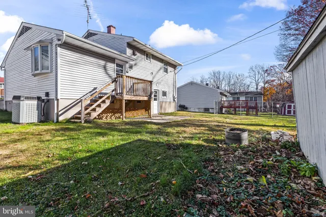 a kitchen with granite countertop white cabinets and stainless steel appliances