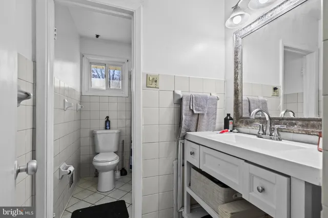 a living room with a couch and a rug