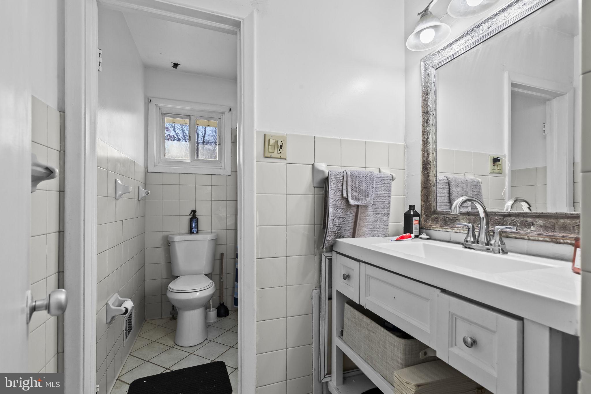 3407 Orbitan Road Parkville, MD 21234 - Photo 19 of 23 a bathroom with a sink toilet and shower