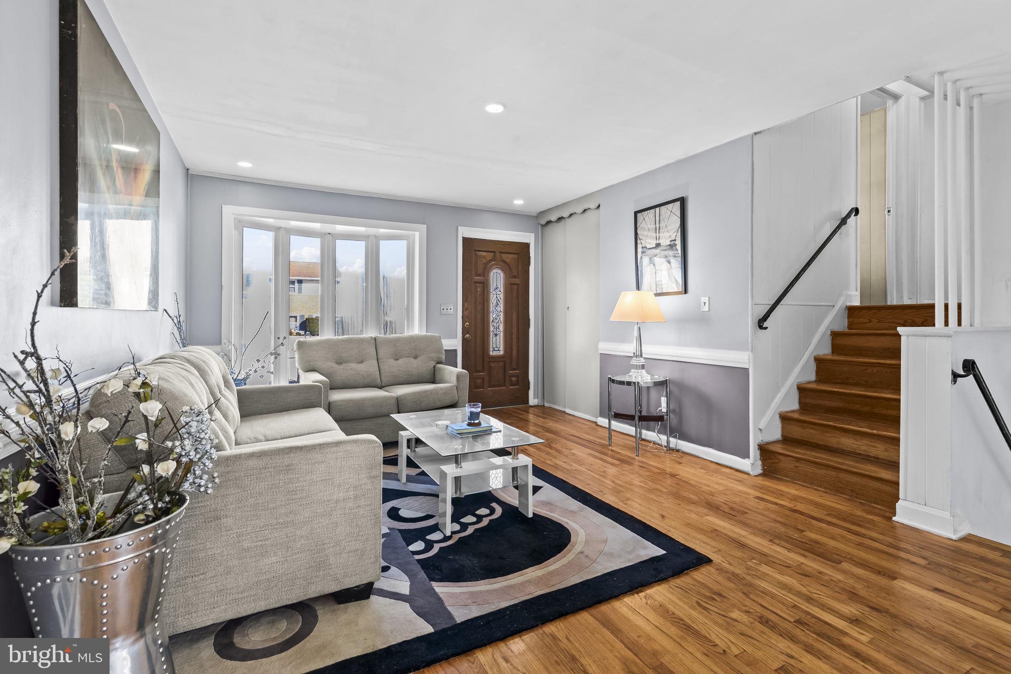 3407 Orbitan Road Parkville, MD 21234 - Photo 2 of 23 a living room with furniture and wooden floor