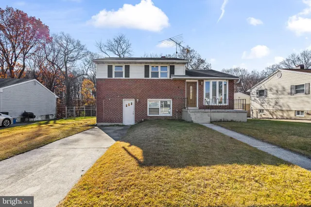 a living room with furniture and a lamp