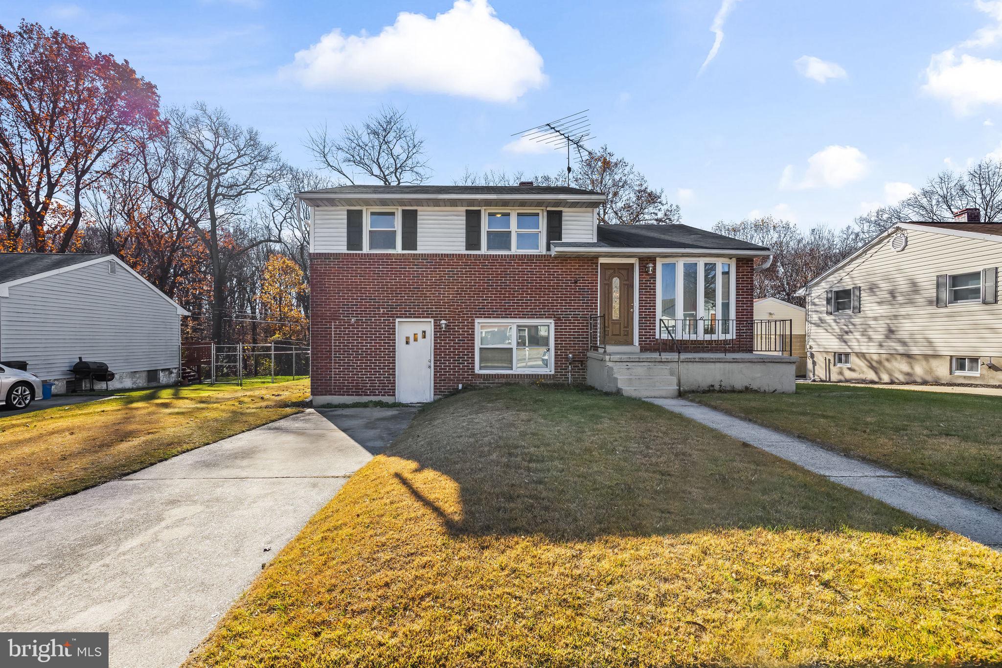 3407 Orbitan Road Parkville, MD 21234 - Photo 6 of 23 a view of a house with a yard and a garage
