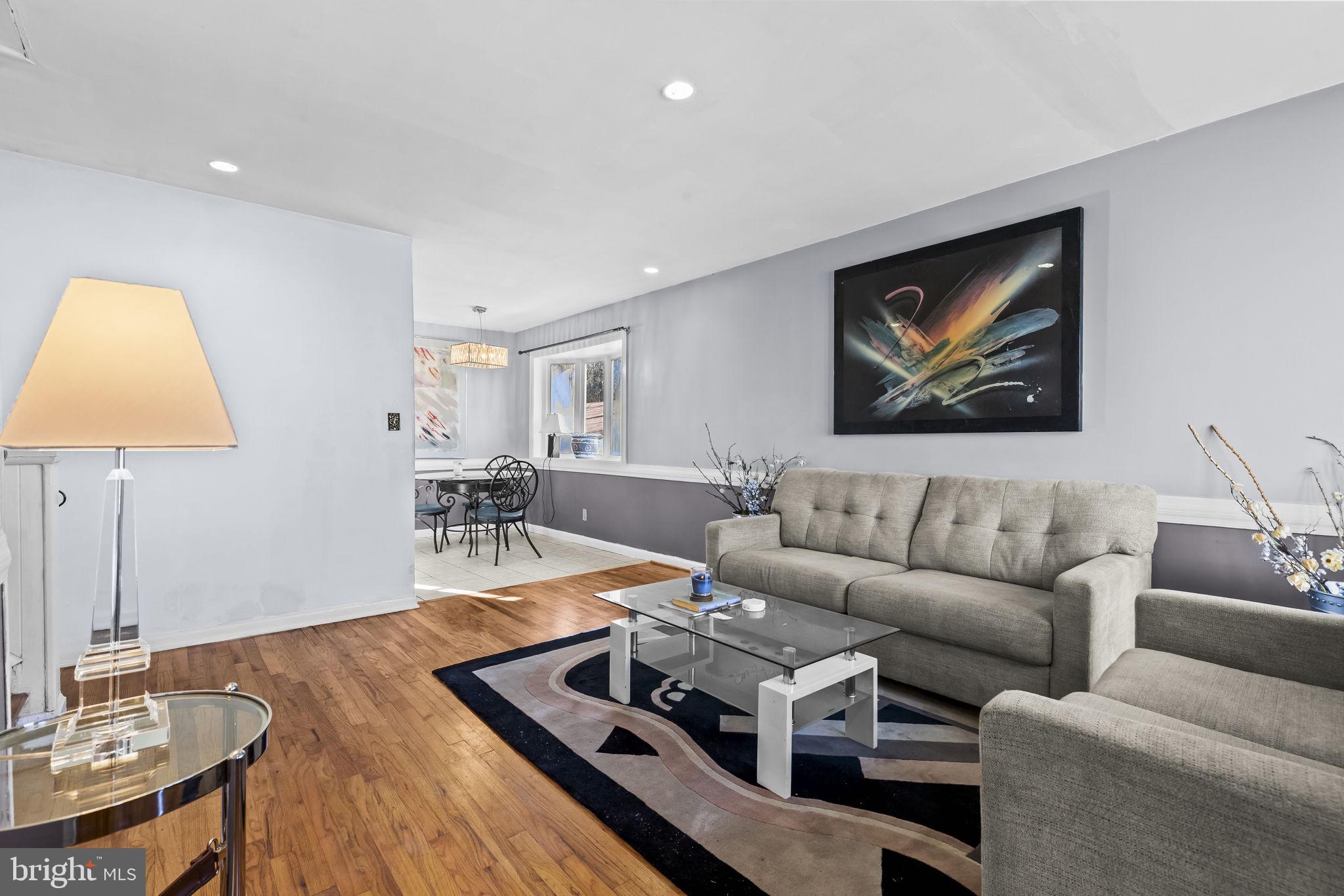 3407 Orbitan Road Parkville, MD 21234 - Photo 7 of 23 a living room with furniture and a lamp