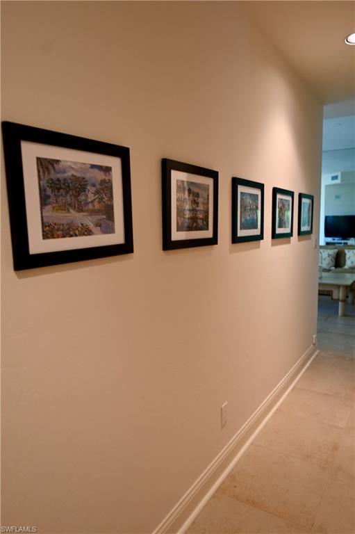 157 Colonade Circle, Unit 1002 Naples, FL 34103 - Photo 19 of 23 Hall featuring light tile patterned floors