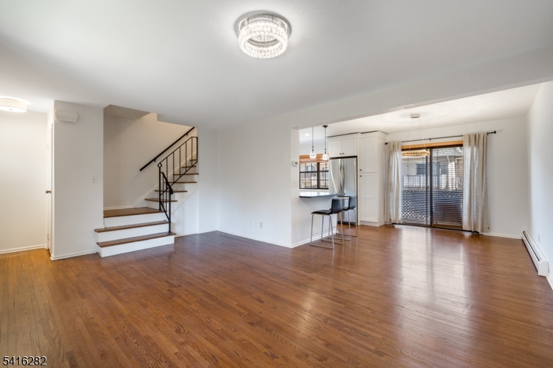768 Springfield Avenue, Unit E4 Summit, NJ 07901 - Photo 13 of 28 a view of empty room with wooden floor