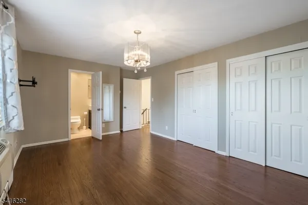 a view of a livingroom with wooden floor