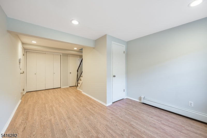 768 Springfield Avenue, Unit E4 Summit, NJ 07901 - Photo 2 of 28 wooden floor in an empty room