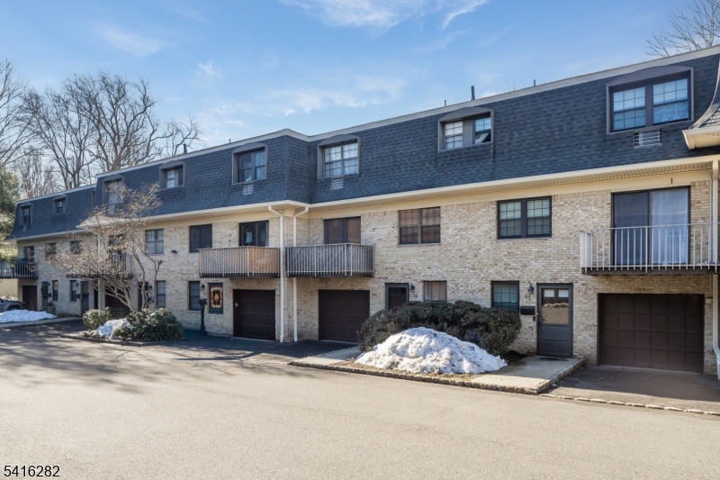 768 Springfield Avenue, Unit E4 Summit, NJ 07901 - Photo 24 of 28 a front view of a building with lot of windows