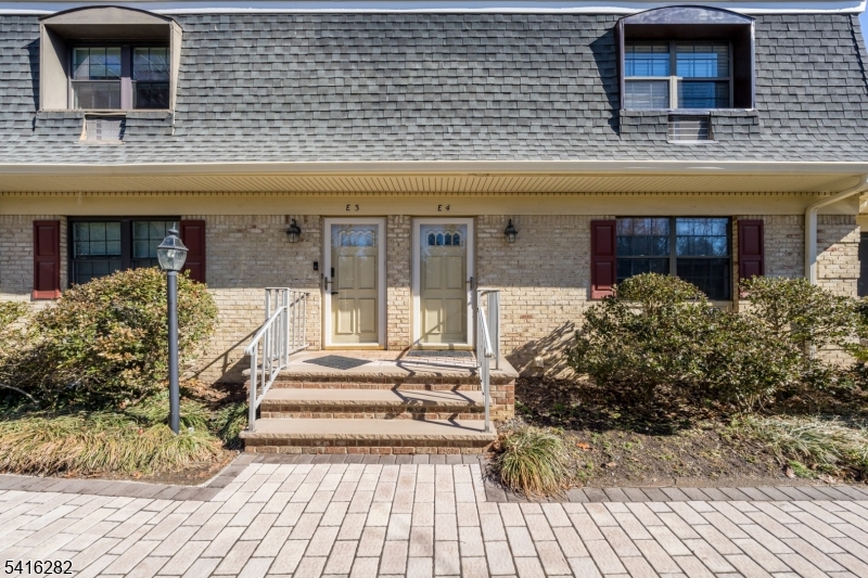768 Springfield Avenue, Unit E4 Summit, NJ 07901 - Photo 27 of 28 a front view of a house with a yard