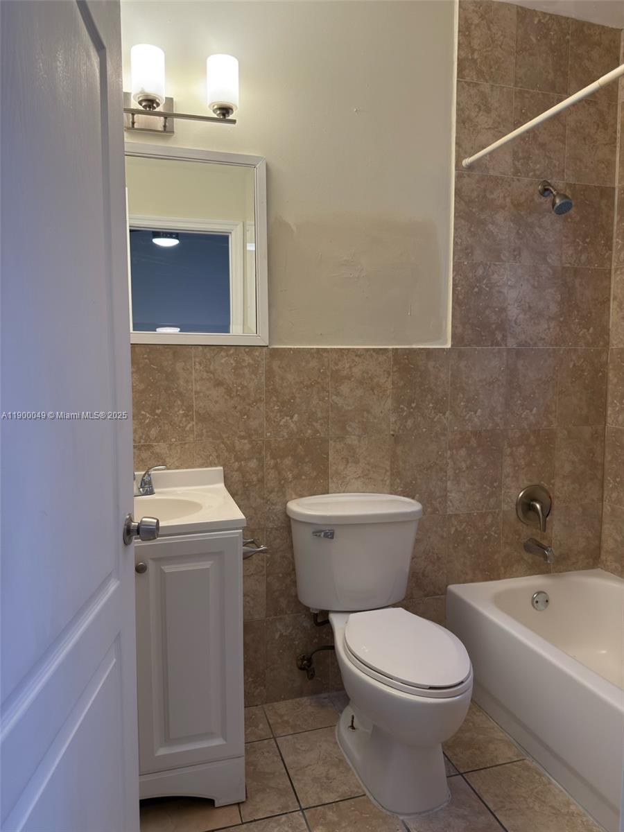1930 Southwest 2nd Street, Unit 3 Miami, FL 33135 - Photo 3 of 6 a bathroom with a toilet a sink and bathtub