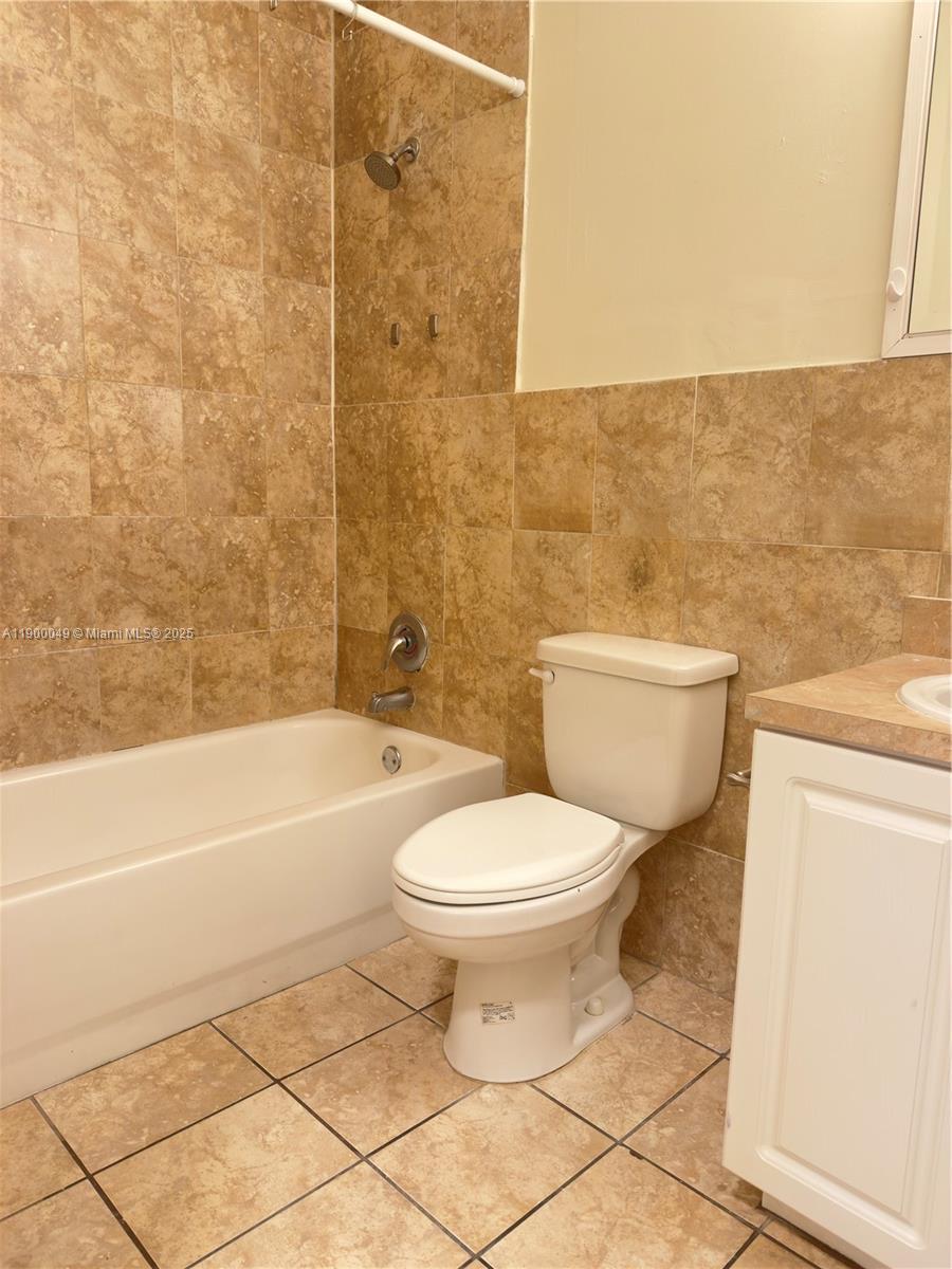 1930 Southwest 2nd Street, Unit 3 Miami, FL 33135 - Photo 5 of 6 a bathroom with a toilet a sink and bathtub