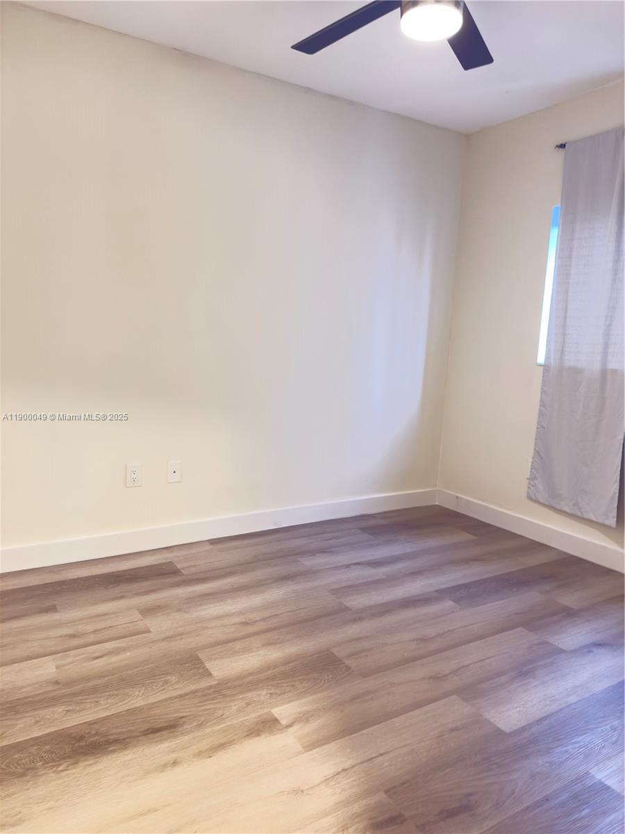 1930 Southwest 2nd Street, Unit 3 Miami, FL 33135 - Photo 6 of 6 a view of an empty room and wooden floor