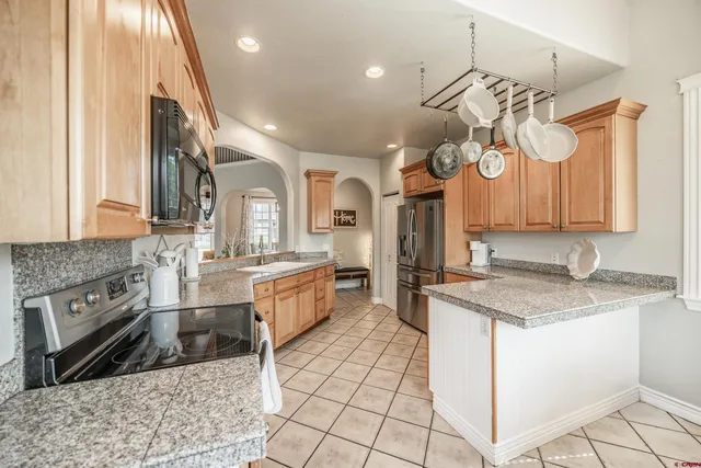 a kitchen with a sink cabinets and window