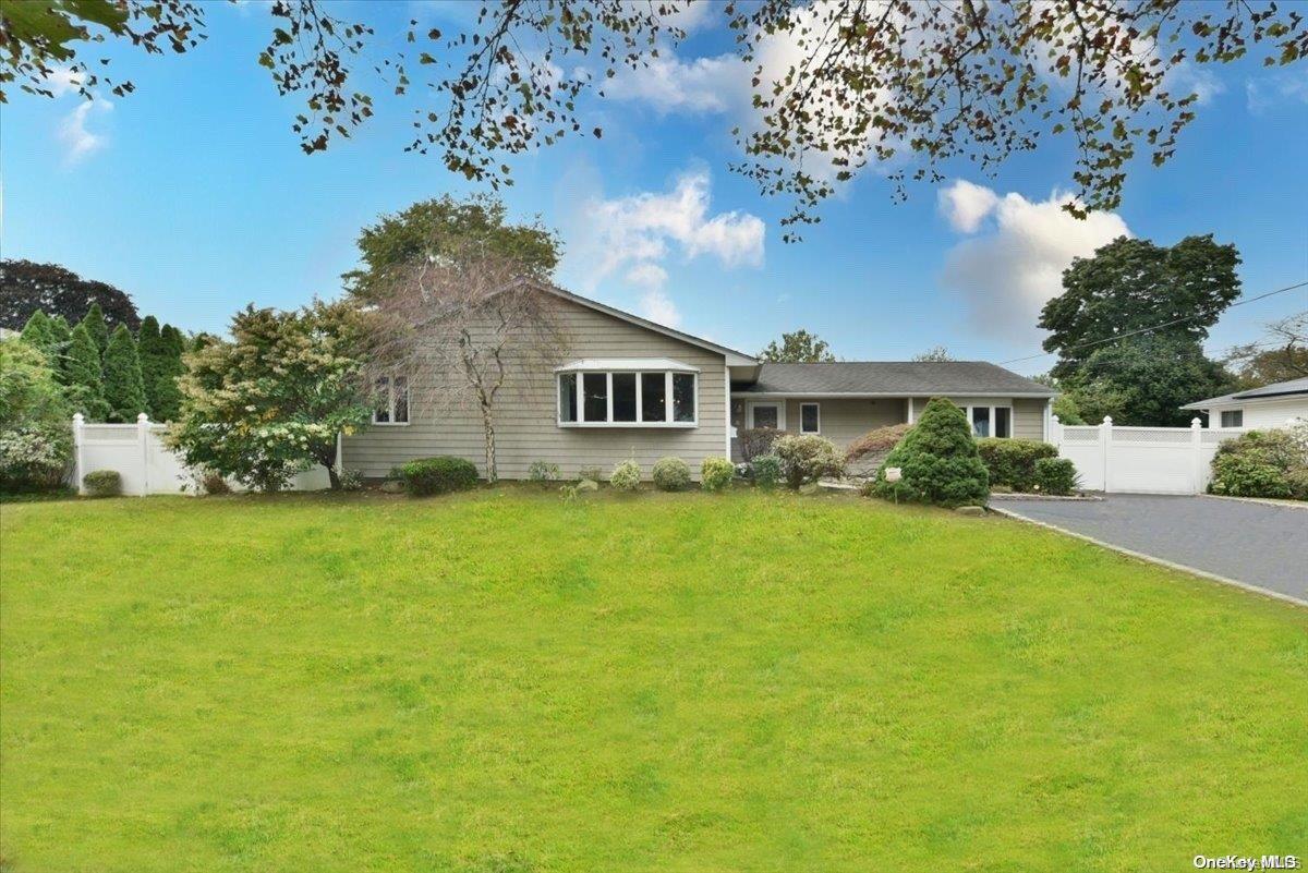 a view of a house with a big yard