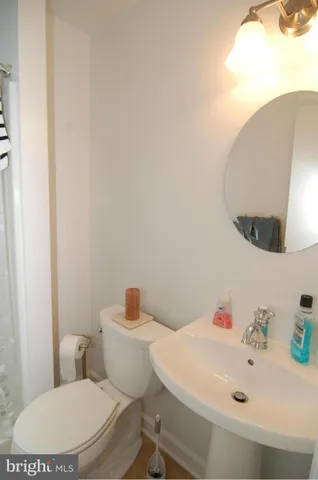 a living room with furniture and a book shelf