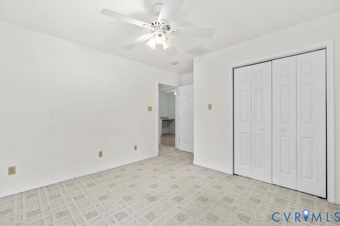 2924 Warfield Ridge Terrace Chester, VA 23831 - Photo 38 of 38 Light-colored patterned carpeting throughout, whit