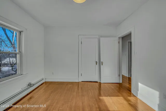 a view of an empty room and window