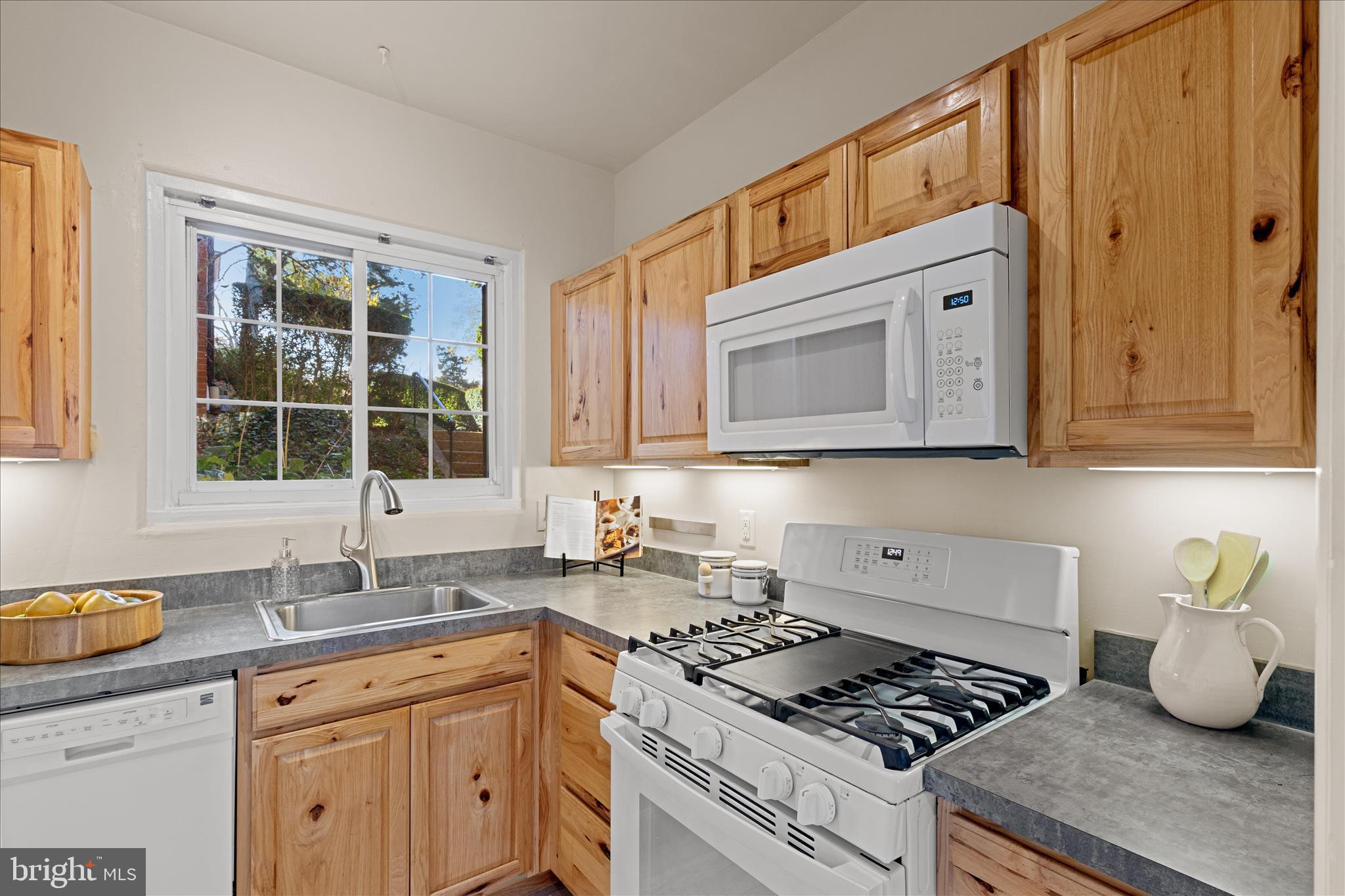 3721 Gunston Road Alexandria, VA 22302 - Photo 11 of 28 a kitchen with stainless steel appliances granite countertop a stove a sink dishwasher and cabinets with wooden floor