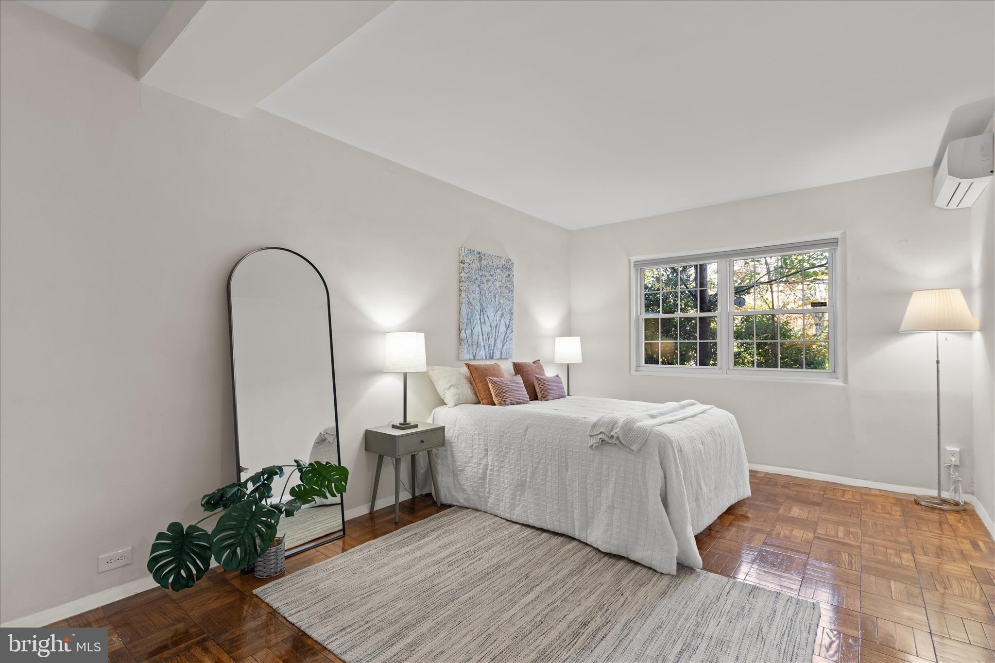 3721 Gunston Road Alexandria, VA 22302 - Photo 14 of 28 a bedroom with a bed lamp and a potted plant