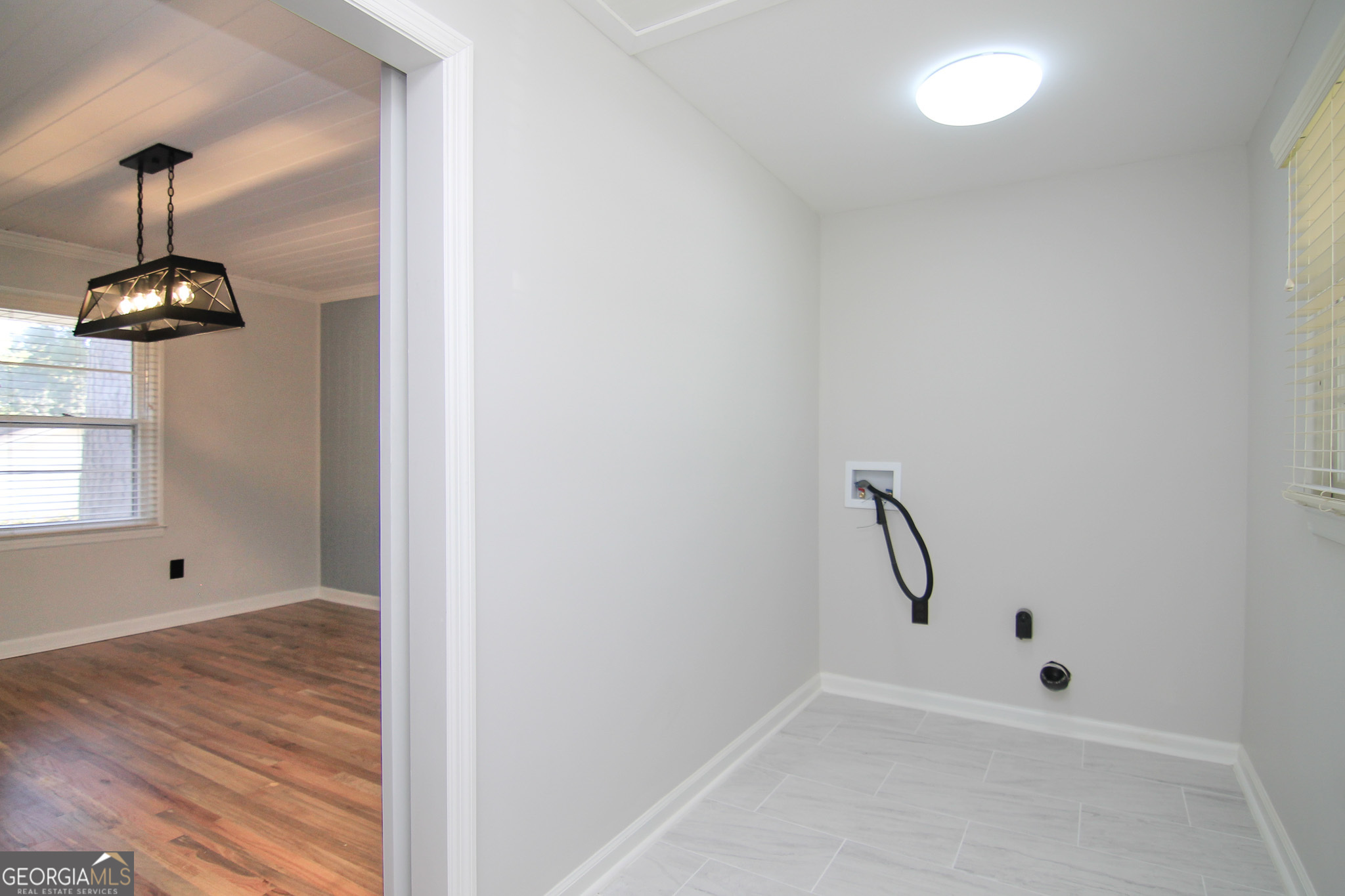 110 Springdale Drive Warner Robins, GA 31088 - Photo 11 of 25 a view of a room with rack and wooden floor
