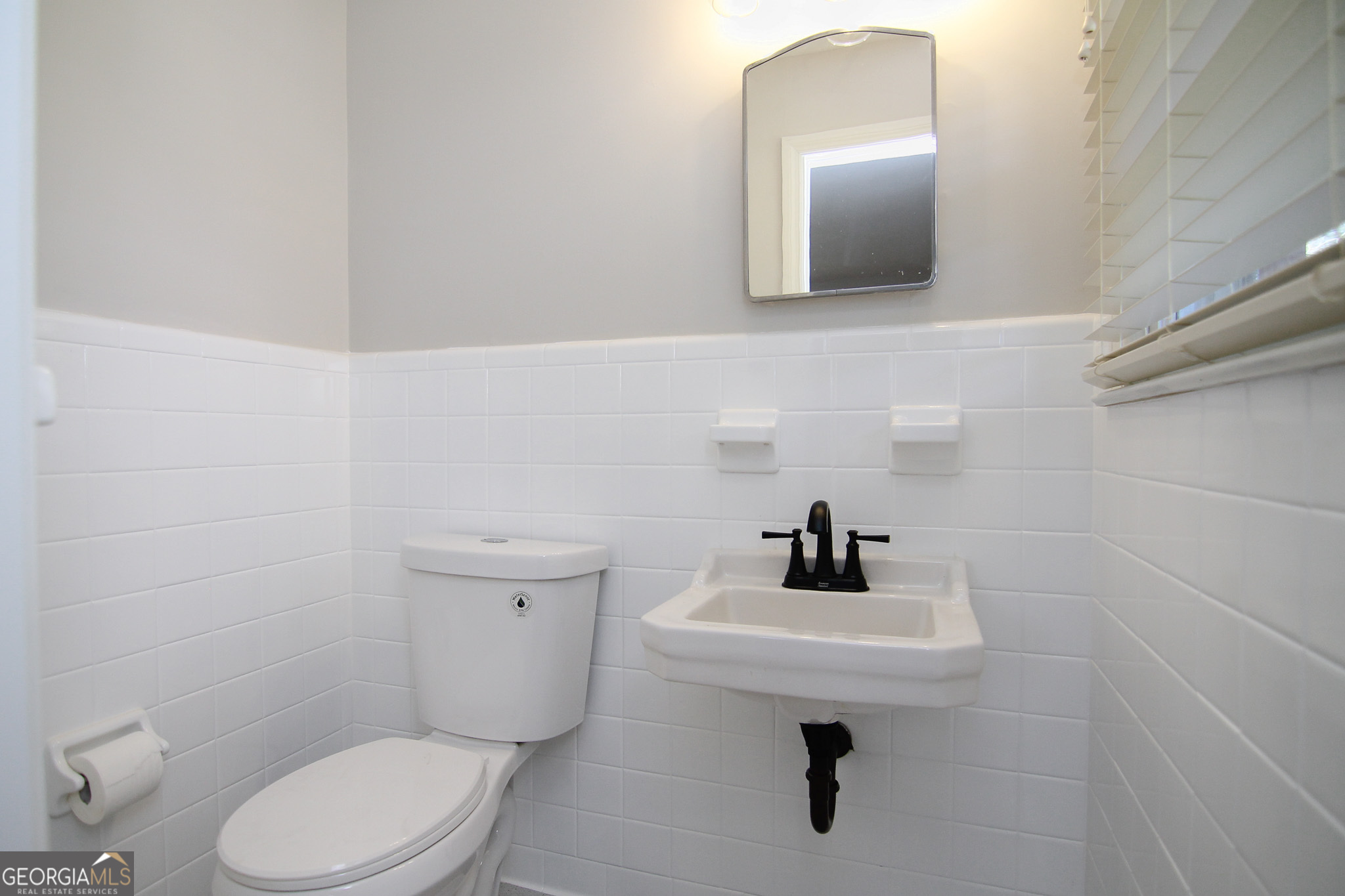 110 Springdale Drive Warner Robins, GA 31088 - Photo 17 of 25 a bathroom with a toilet sink and mirror