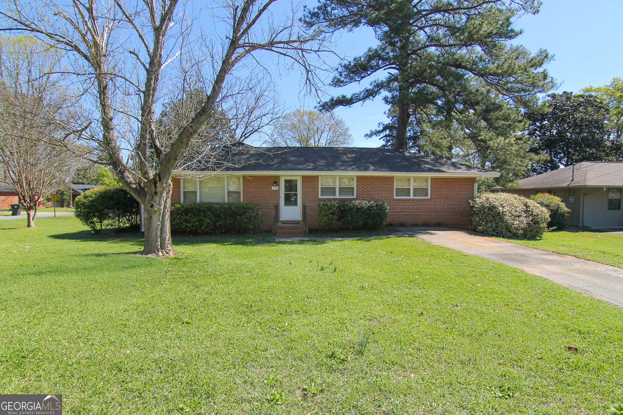 110 Springdale Drive Warner Robins, GA 31088 - Photo 2 of 25 a view of house with backyard space and garden