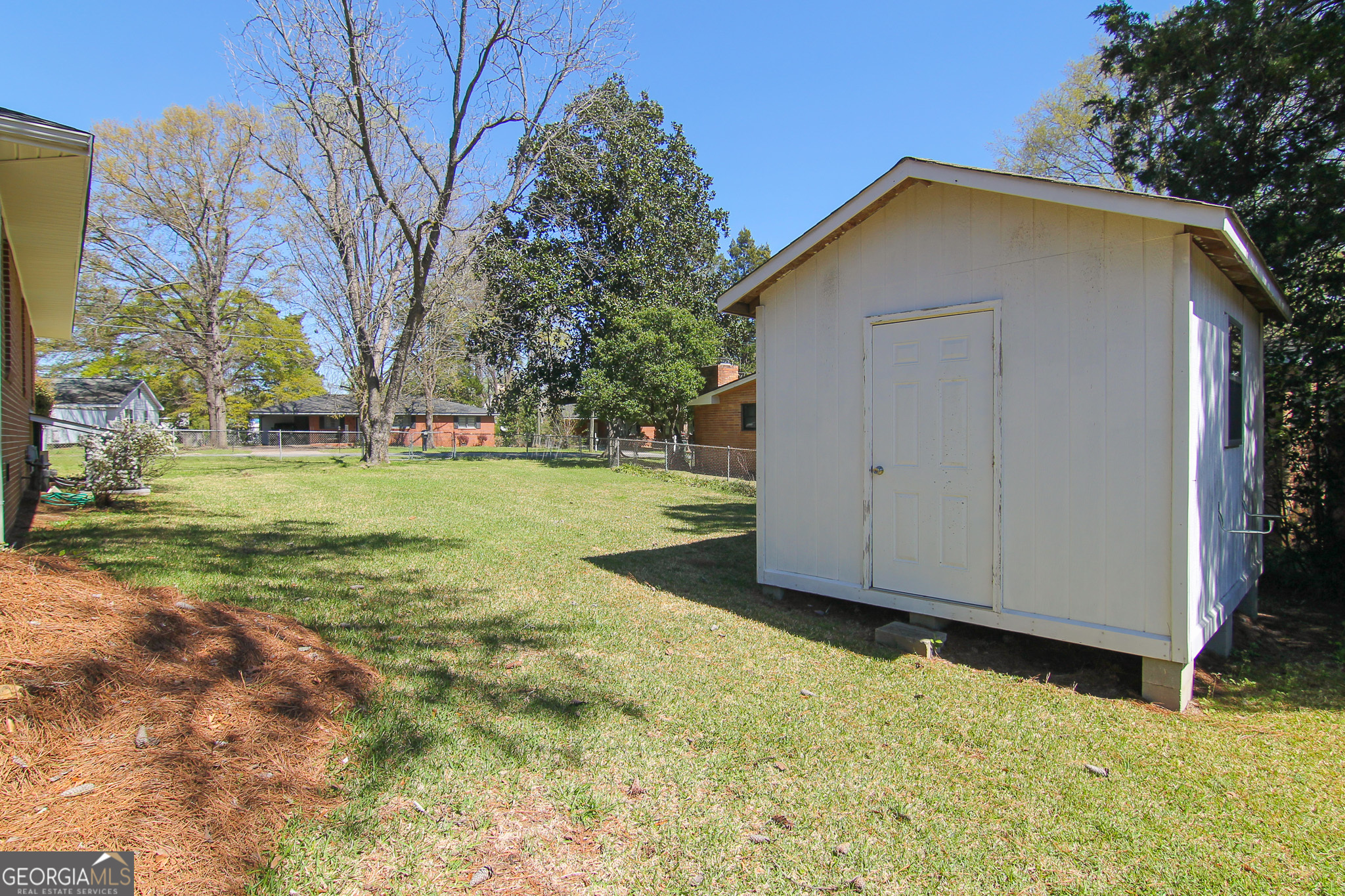 110 Springdale Drive Warner Robins, GA 31088 - Photo 23 of 25 a view of a house with backyard and trees