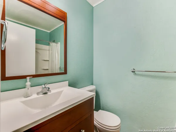 a bathroom with a sink and a toilet