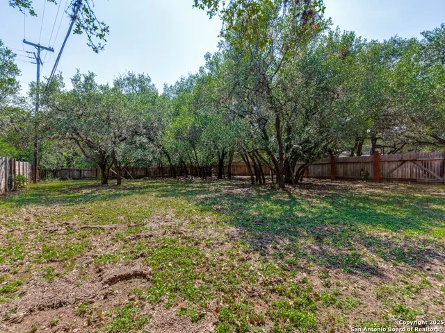 a view of outdoor space with deck and yard