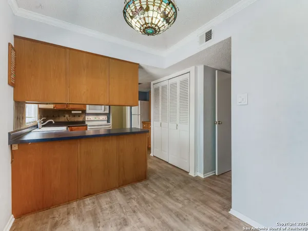 a view of kitchen and front door