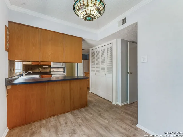 a view of kitchen and front door
