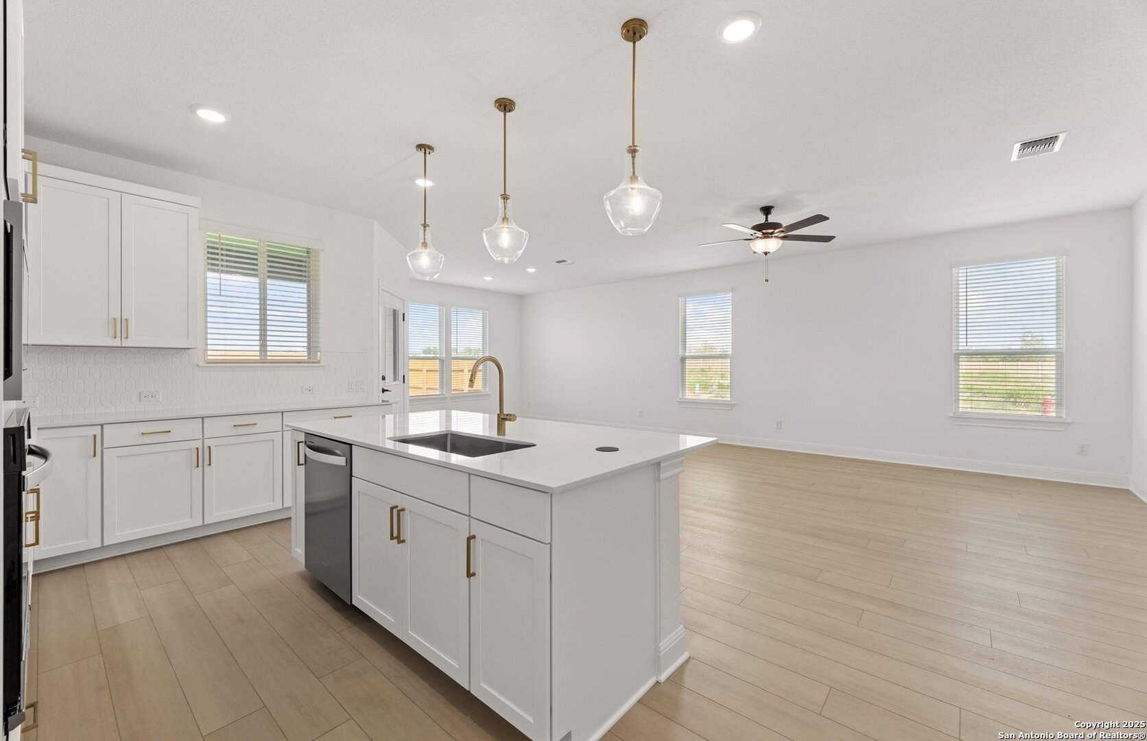419 Nightingale Avenue Marion, TX 78124 - Photo 14 of 32 a kitchen with a sink stove and cabinets