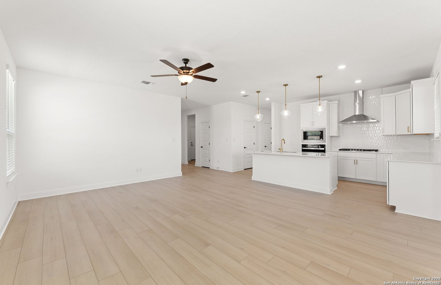 419 Nightingale Avenue Marion, TX 78124 - Photo 15 of 32 a view of a kitchen with a sink and a refrigerator