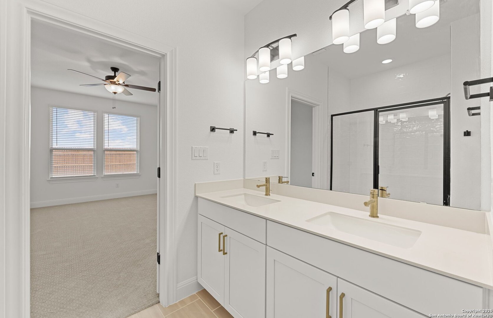 419 Nightingale Avenue Marion, TX 78124 - Photo 20 of 32 a bathroom with a sink vanity and a mirror