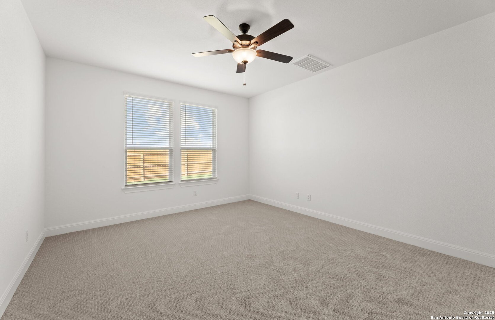 419 Nightingale Avenue Marion, TX 78124 - Photo 23 of 32 an empty room with ceiling fan and window