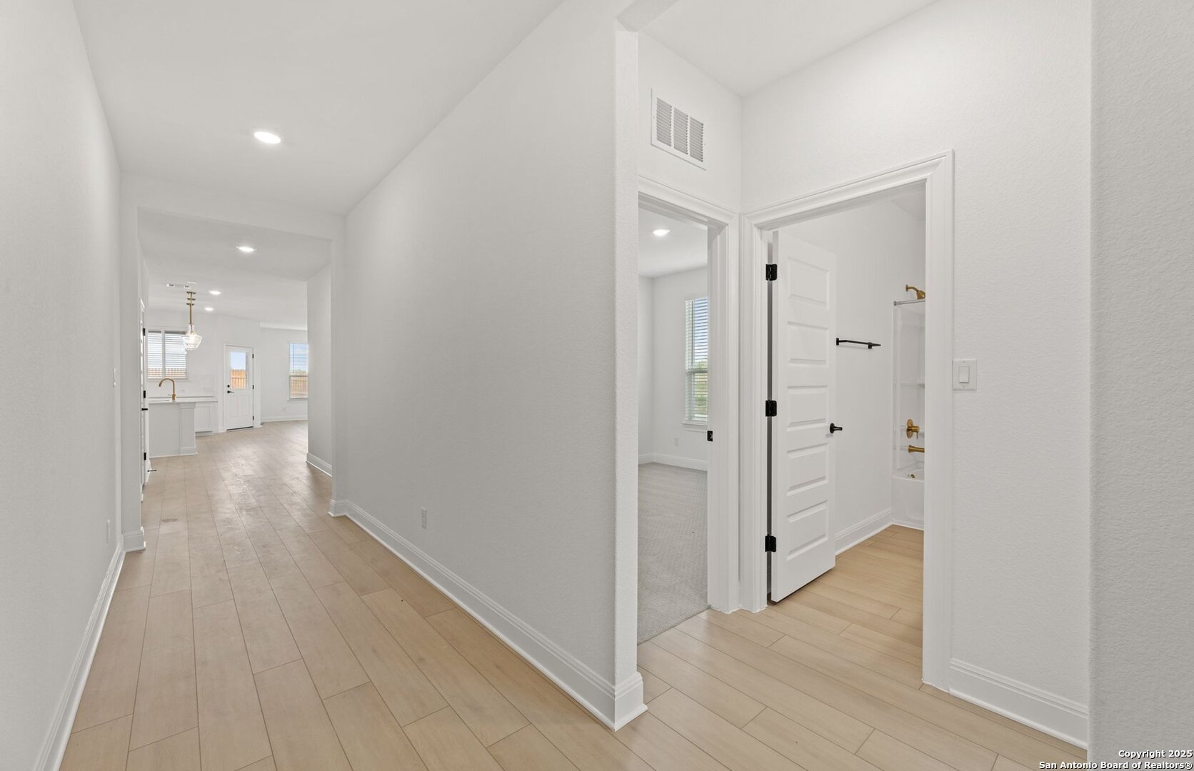 419 Nightingale Avenue Marion, TX 78124 - Photo 3 of 32 a view of a hallway with wooden floor