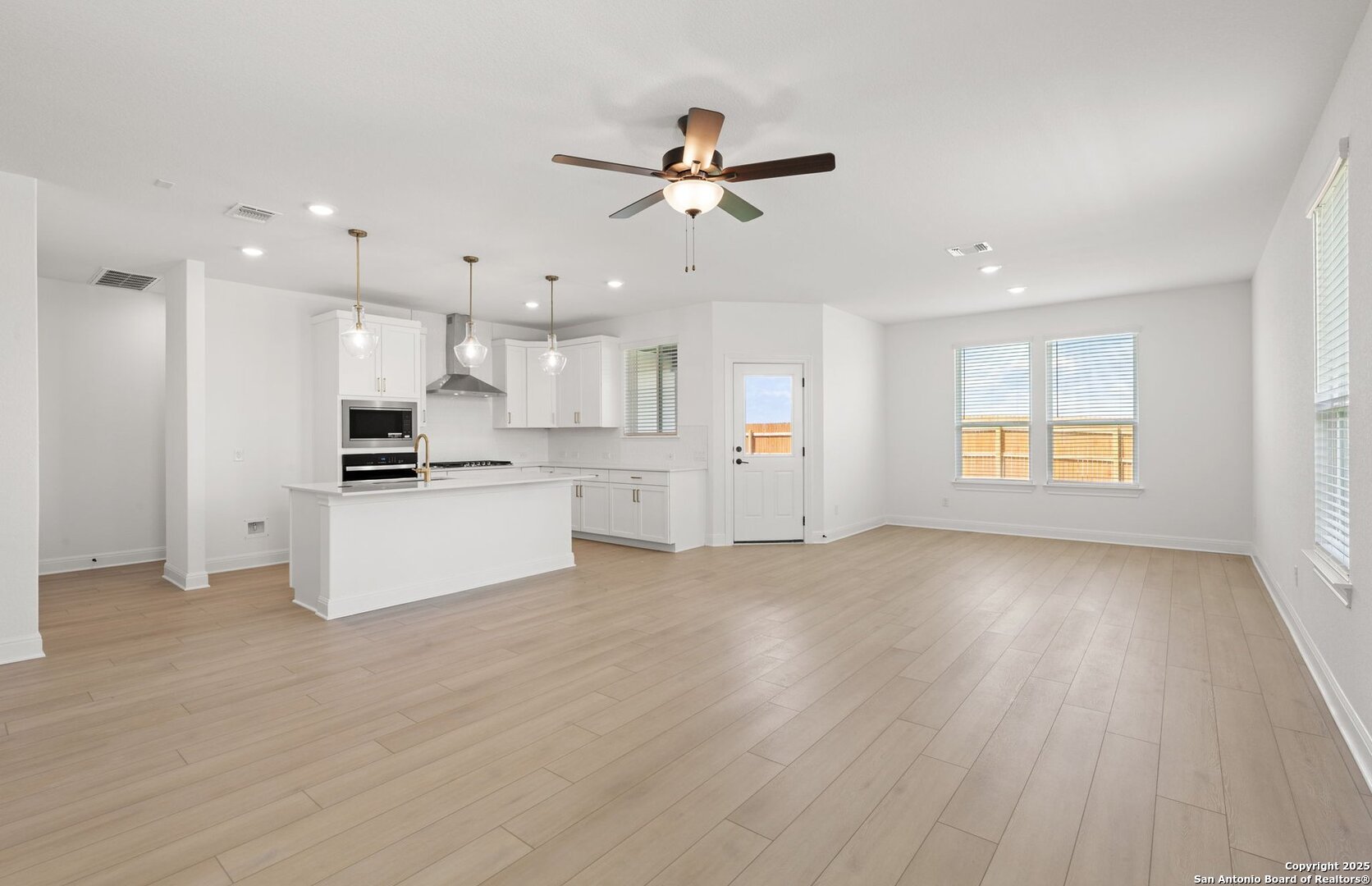 419 Nightingale Avenue Marion, TX 78124 - Photo 6 of 32 a view of an empty room with kitchen appliances and a window