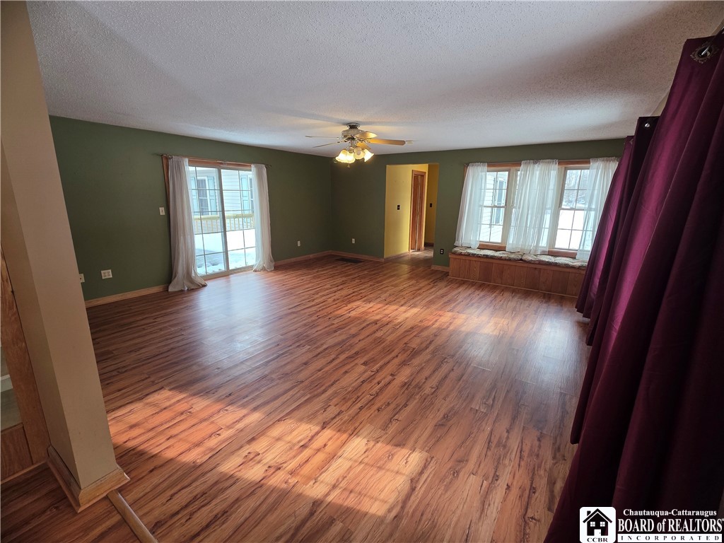 6720 Moore Road Chautauqua, NY 14757 - Photo 17 of 50 Spacious living room with access to the new back d