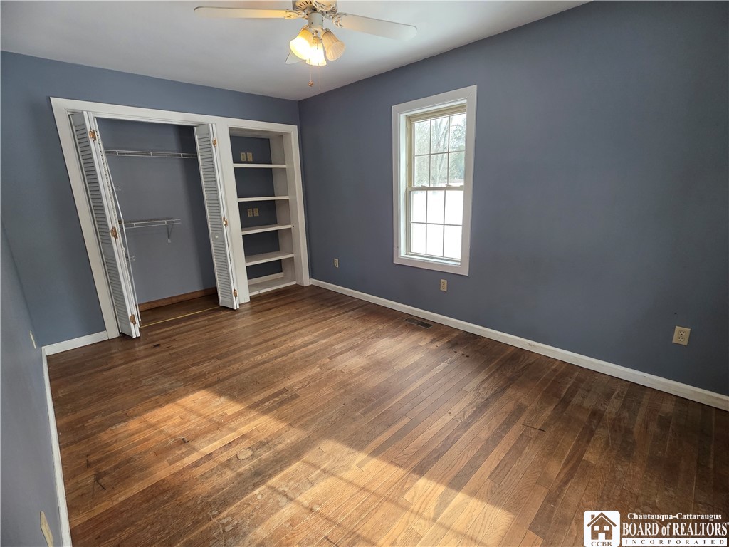 6720 Moore Road Chautauqua, NY 14757 - Photo 24 of 50 Bedroom #1 with hardwood floors and loads of natur