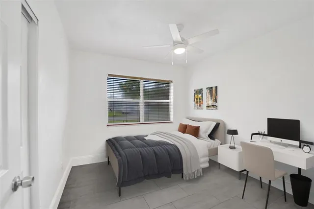 a bedroom with a large bed and a window