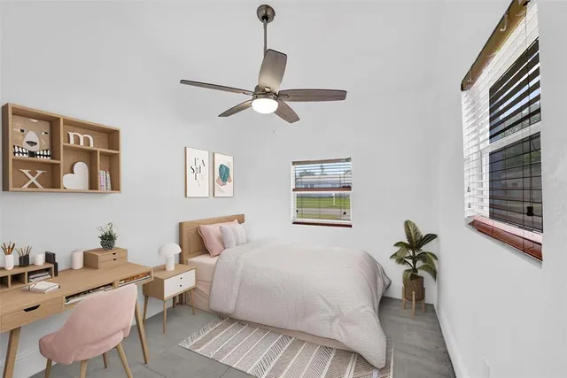 a bedroom with a bed and a couch