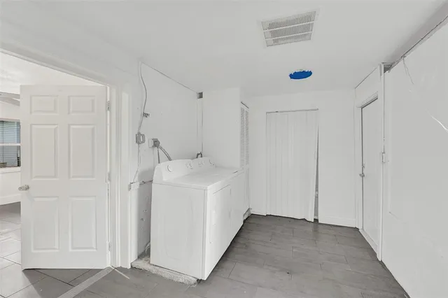 a view of a storage & utility room with washer and dryer