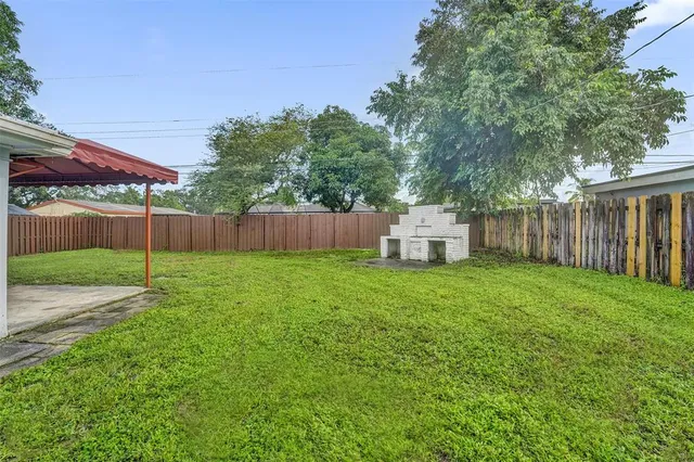 a fire hydrant in the middle of a yard