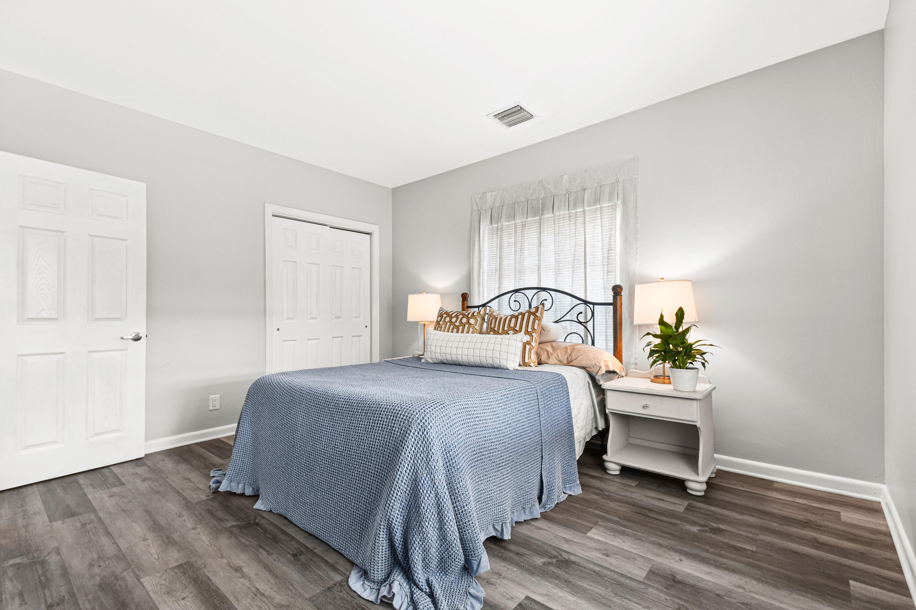 1102 Sunset Road West Palm Beach, FL 33401 - Photo 22 of 37 a bedroom with a bed and a table